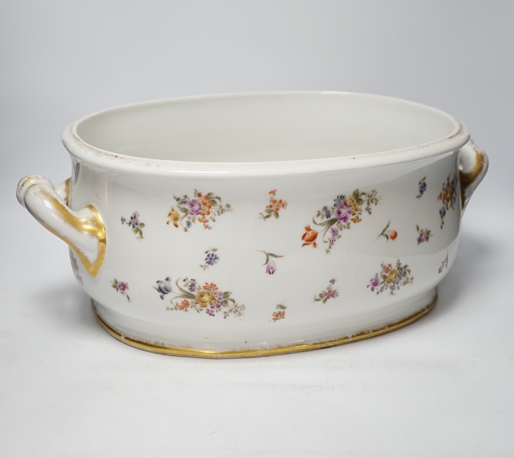 An Edwardian porcelain floral and gilt decorated foot bath, top 40cm wide not including handles